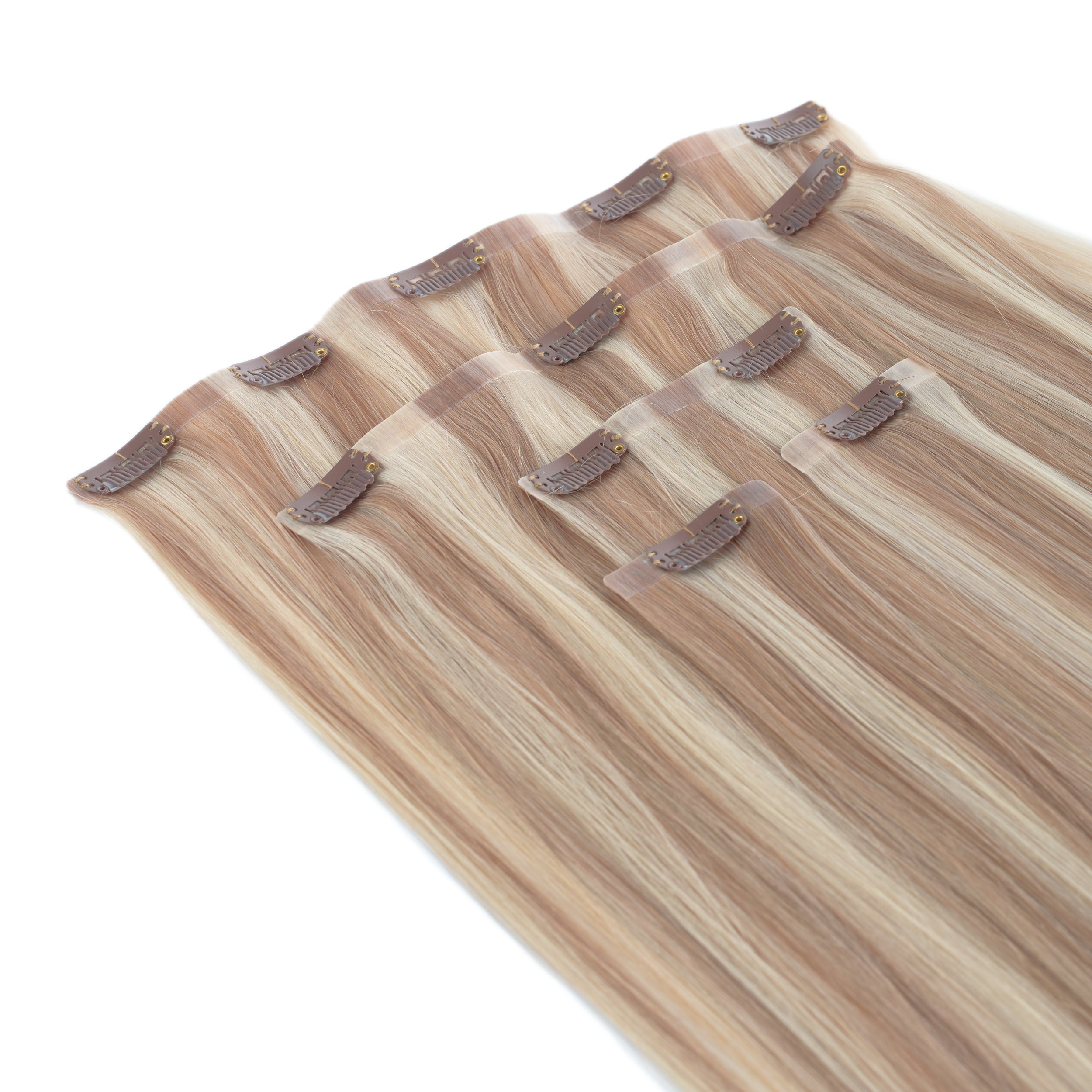 Set of hair extensions with clips on a white background