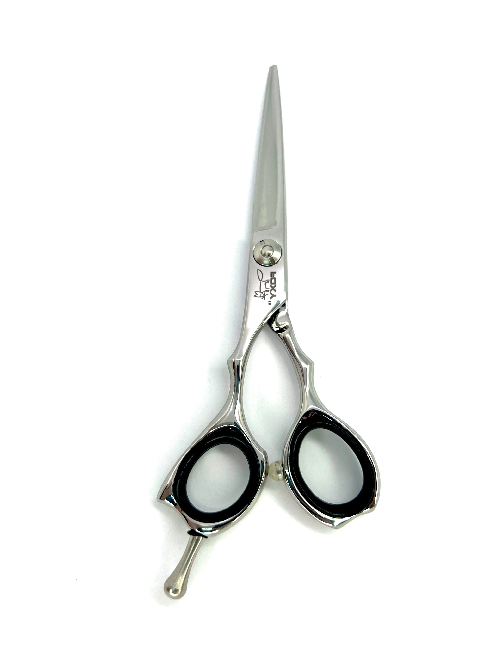 Foxy Hair cutting scissors with black handles, removable finger rest on a white background