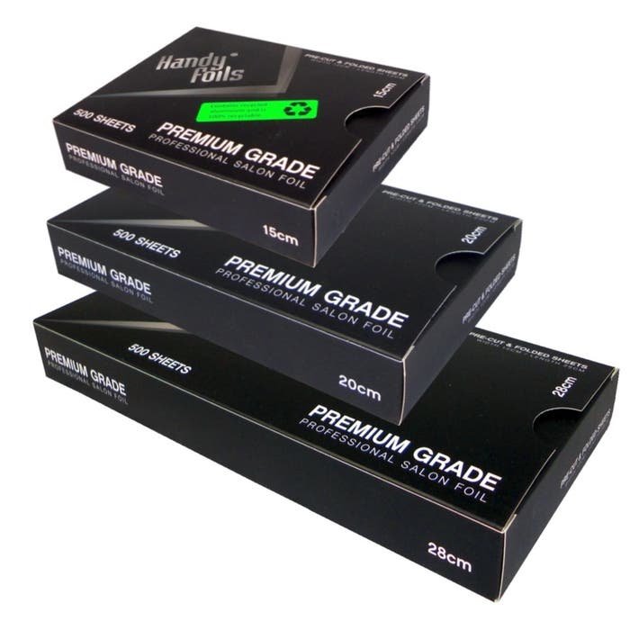 Stack of black hair foil boxes labeled 'Handy Foils Premium Grade Professional Salon Foil' on a white background