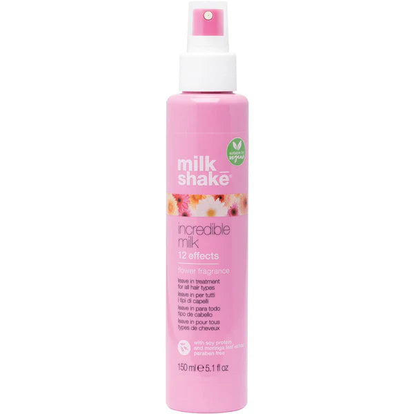 Pink spray bottle with 'milk shake' branding on a white background
