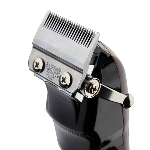 Hair clipper head with visible branding on a white background