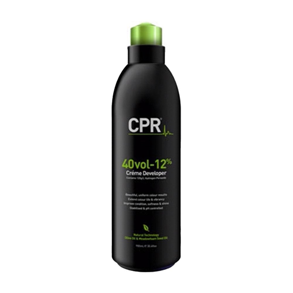 Black bottle of CPR Creme Developer with green cap on a white background
